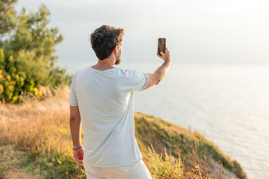 Remote worker taking selfie, dreaming digital detox adventure