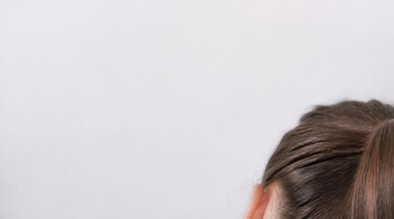Fototapeta premium Person's dark hair top of head close up