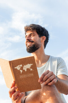 vertical Man enjoying digital detox dreaming about travel adventures