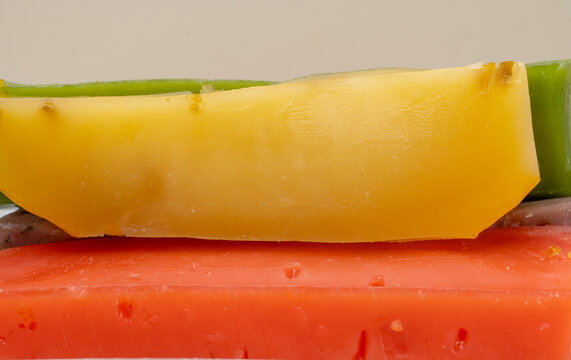 different types of gouda: plain yellow cheese and green cheese with pesto, spices and nuts. Cheese plate