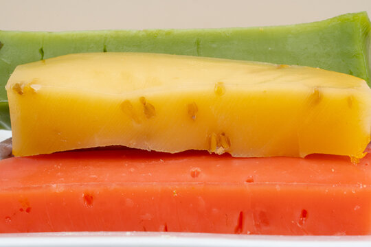 different types of gouda: plain yellow cheese and green cheese with pesto, spices and nuts. Cheese plate