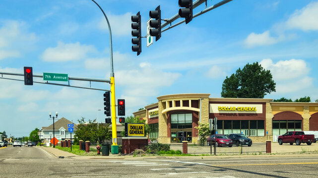Anoka, MN - Jun 9, 2026: Modern Dollar General store facade located at a street intersection along Main Street. Editorial Use Only.