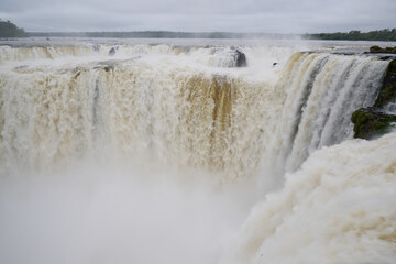 water flowing over a waterfall at Iguacu © Jack Metthey