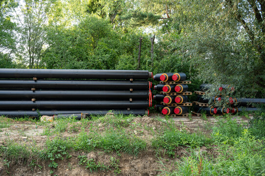 Outdoor Construction Storage of Pre-Insulated District Heating Pipes with Red Caps