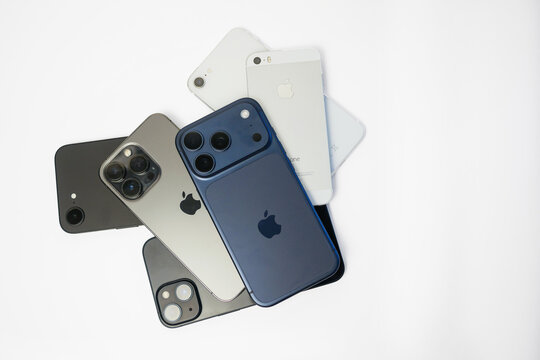 Vienna, Austria - 17 July 2026: Apple iPhone evolution with iPhone 17 Pro and previous generation smartphones (16, 15, 13 Pro, SE, 5S) flat lay isolated on white background