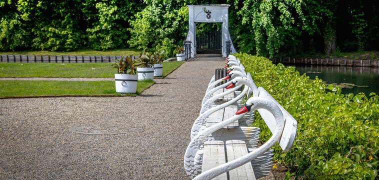 Swans as a garden bench in a Castel park