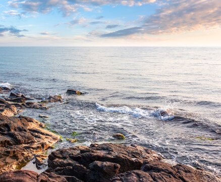 sea coast with stones and rocks. summer vacation background. seascape in the morning light. relaxing at the sea. coast of bulgaria