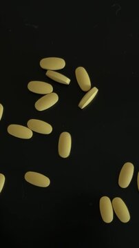 Spilling Yellow Medication Pills Top View