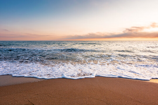 black sea landscape on a summer morning. bulgaria nature landscape with sandy beach. summer vacation at the sea shore concept. calm waves and empty beach. remote vacation scene