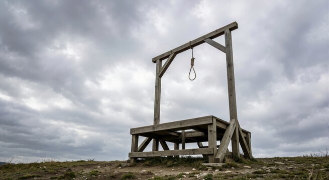 Empty wooden gallows with a noose against a cloudy sky. Capital punishment and historical execution concept. World Day Against the Death Penalty
