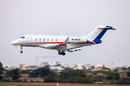 Luqa, Malta - July 18, 2026: Ryanair owned Bombardier Challenger 3500 (BD-100-1A10) (REG: M-ABTE) landing in low light.