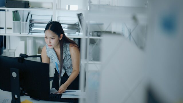 Office, worker, and office worker scene featuring employee and working in a contemporary setting, person, folder, executive, work, secretary, successful, businesswoman, woman, job.