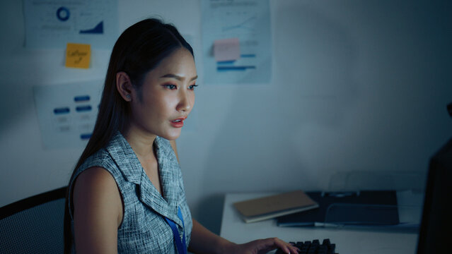 Overtime, worker, and woman scene featuring office and businesswoman in a contemporary setting, businessperson, disease, work, working, night, night time, nighttime, employee, business.
