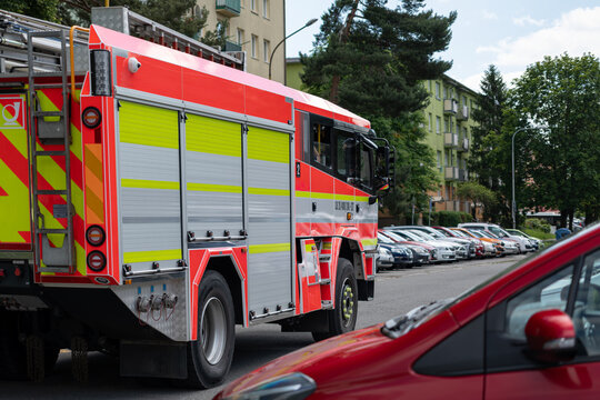 Fire truck driving in a parking lot.