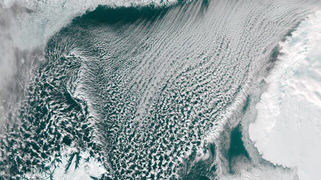 Aerial perspective on  cold north water body with cloud formation. Camera is moving backward. Animation based on image by NASA