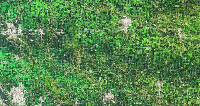 Top view on square agricultural parcels. Camera is moving right and down. Animation based on image by NASA