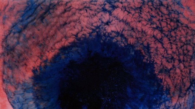 Alcohol ink mixing creates colorful patterns on a flat surface