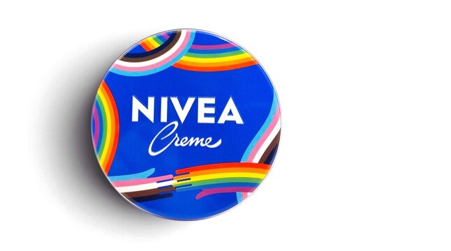Top view of a limited-edition NIVEA Creme tin featuring a vibrant Pride-inspired rainbow design. NIVEA is a German personal care brand renowned for its skin and body care products.