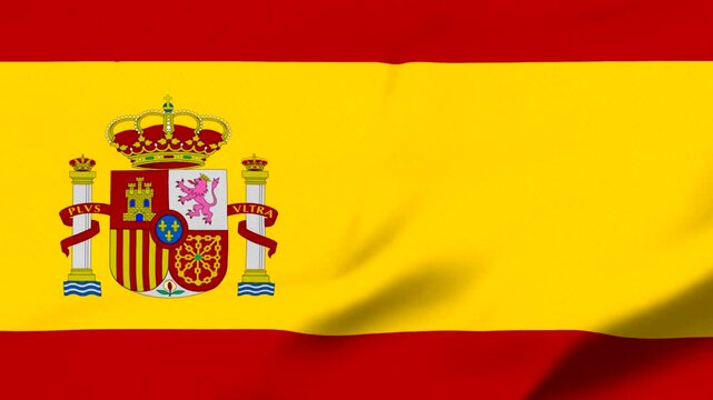 Spanish flag with coat of arms waving in the wind