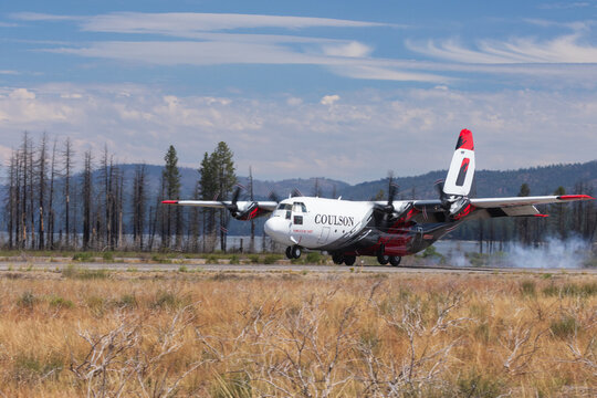 CHESTER, CALIFORNIA - JULY 19, 2026: Coulson C-130 Hercules air tanker Tanker 140 touches down at Rogers Field responding to the Biscar Fire.