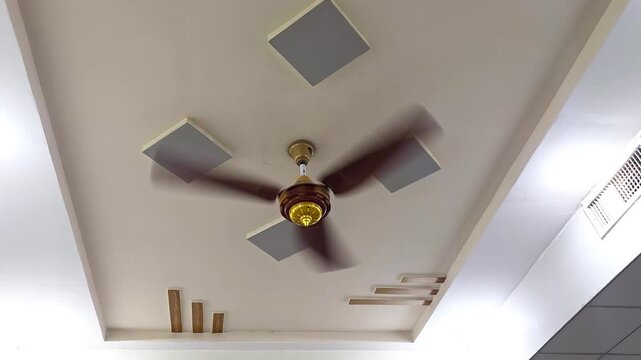Modern false ceiling design with ceiling fan. Interior architecture of a contemporary room.