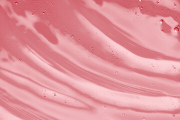 Naklejka premium Pink transparent cosmetic product as background, closeup
