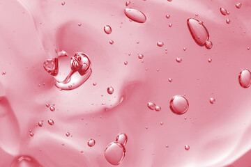 Naklejka premium Pink transparent cosmetic product as background, closeup