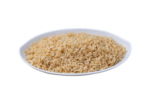 Cooked brown whole rice in a plate isolated over white background