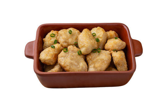 Breaded chicken bites in a plate isolated over white background
