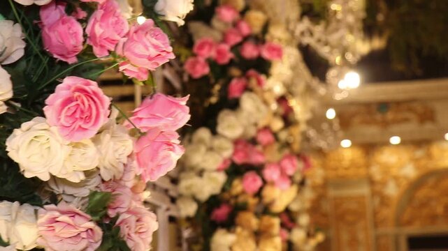 Elegant pink and white rose floral wall decoration with chandelier with roses chandeliers golden video luxurious floral golden decor celebration