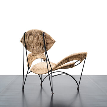 armchair with metal frame and seat in woven natural fibre.