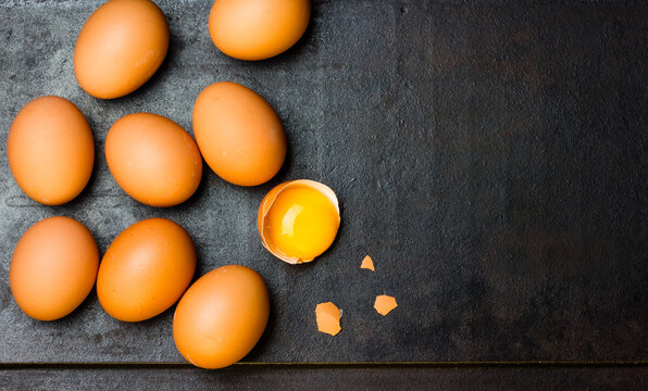 Fresh eggs on black background