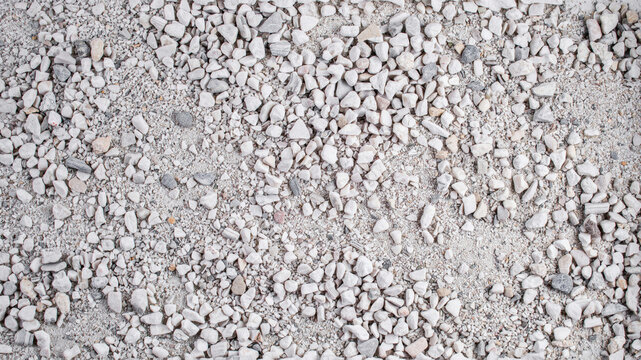 Top down view of gravel texture. Small crushed stones and pebbles for construction background.