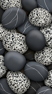 High Angle View of Abstract Pattern Composed of Smooth Dark Pebbles and Speckled White Stones for Modern Decorative Background Surface