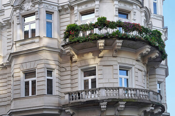 ornate baroque style apartment building with curved balconies © Spiroview Inc.
