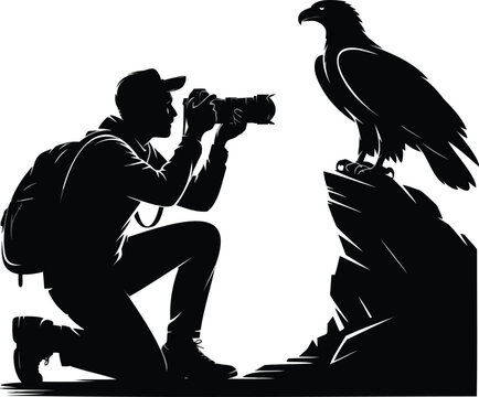 Silhouette of a photographer kneeling on a rock and taking a of a large eagle perched camera bird