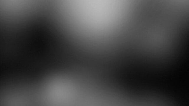 abstract blurred gradient background with dark grey tones creating a soft versatile visual effect perfect for modern design or copy space