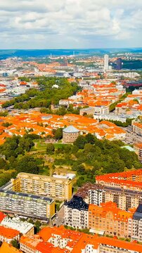 Vertical video. Gothenburg, Sweden. Skansen Kronan - A fortress on a hill with panoramic views of the city. Panorama of the city. Summer day. Cloudy weather. Drone footage, Point of interest. Rich co
