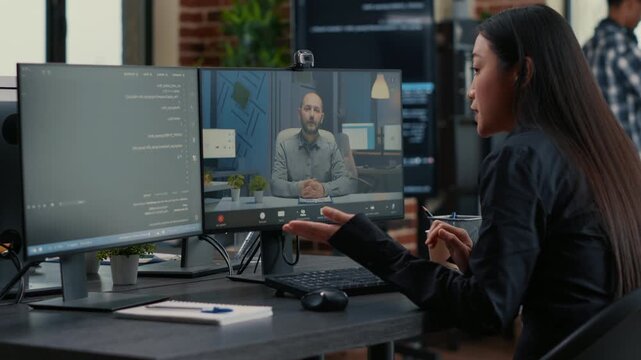 Freelance software programmer speaks with a project owner on a remote call about a development project, connecting client communication, code planning and online teamwork