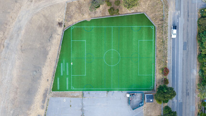 Aerial Top Down View of Green Artificial Turf Soccer Field © Vit Onopriienko