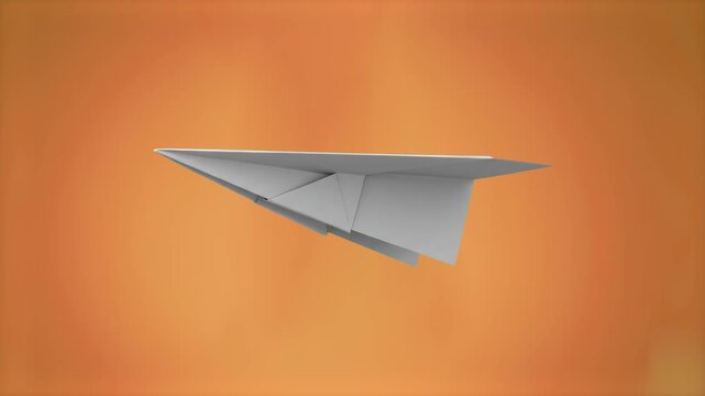 A simple white paper airplane gliding horizontally in side profile view against a warm orange gradient background. Perfect for concepts representing business launching, creative ideas, message deliver