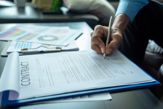 Banner man Hands writing planning notebook. Banner Businessman hand using pen signing new contract starting projects in conference room. Close up male hand holding pen write on diary sketchbook