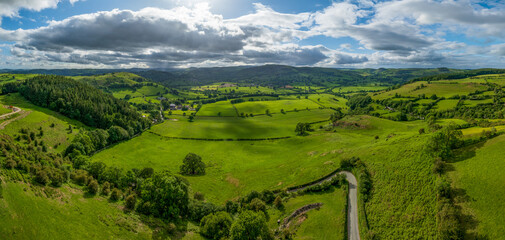 An aerial perspective of the lush green pastures and winding lanes looking towards Llansilin near Oswestry on the border of Shropshire and Wales. © steheap