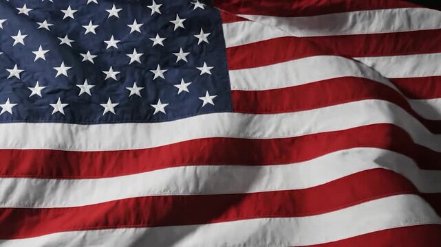 Close up of a textured American flag with red and white stripes