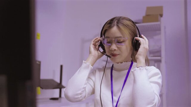 Asian woman taking off her eye glasses after working on computer late