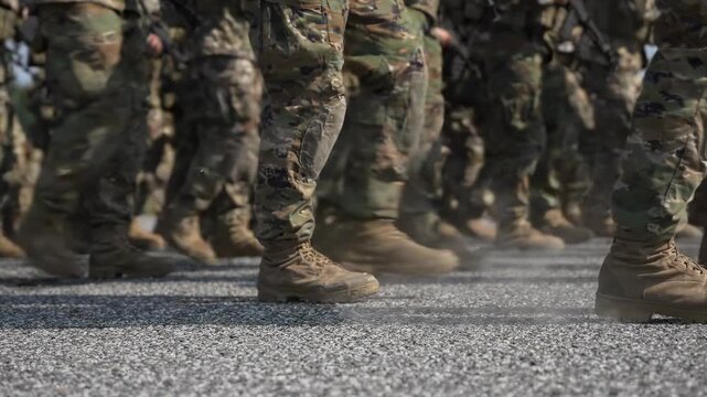 Soldiers marching and running in military formation