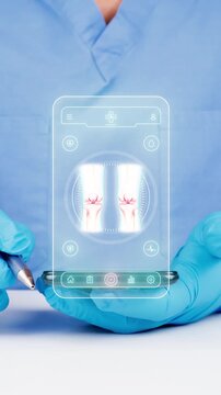 Doctor using a telemedicine and AI mobile app for digital monitoring of the knee and bone health. Modern concept in traumatology and orthopedics.
