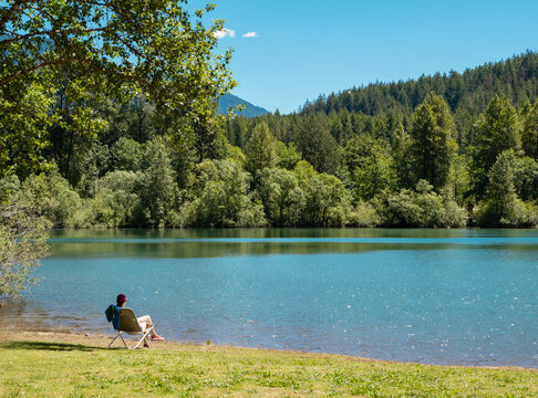 relaxing woman in chair rattlesnake lake seattle washington