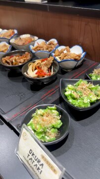 Assorted Japanese Side Dishes in Small Bowls at Bangkok Buffet
