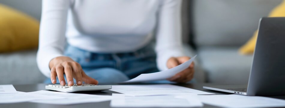 Finance person using calculator for budget and money accounting savings expenses